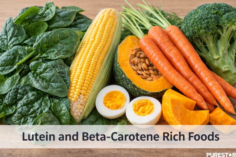 Lutein and beta-carotene rich foods including spinach, corn, carrots, pumpkin, broccoli and eggs displayed on a wooden background for eye health nutrition